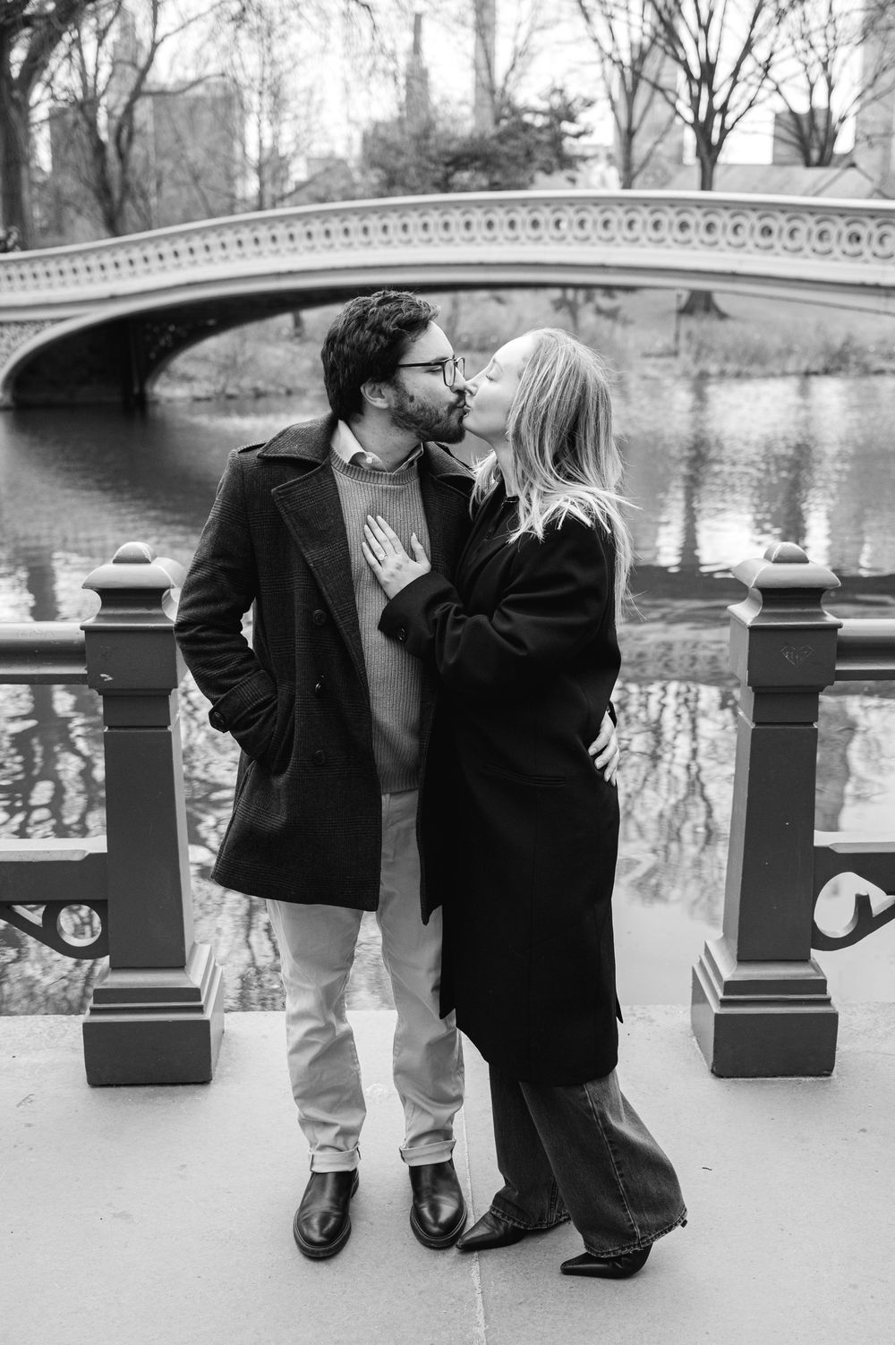 Black and white photos capture a romantic bridge proposal moment in a park setting.