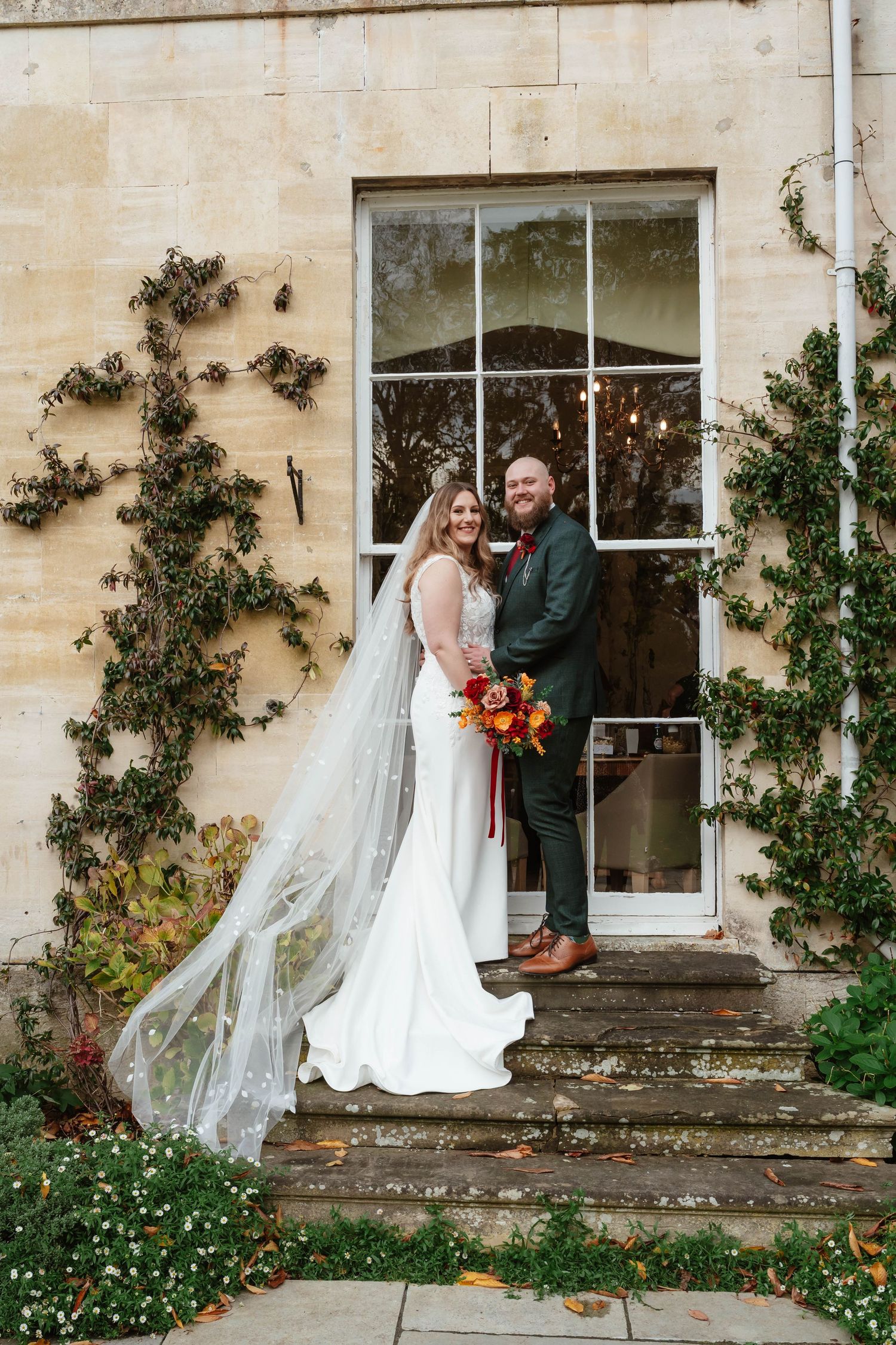 Cotswolds countryside wedding venue landscape Kingscote barn black and white image of couple Cotswolds wedding photographer