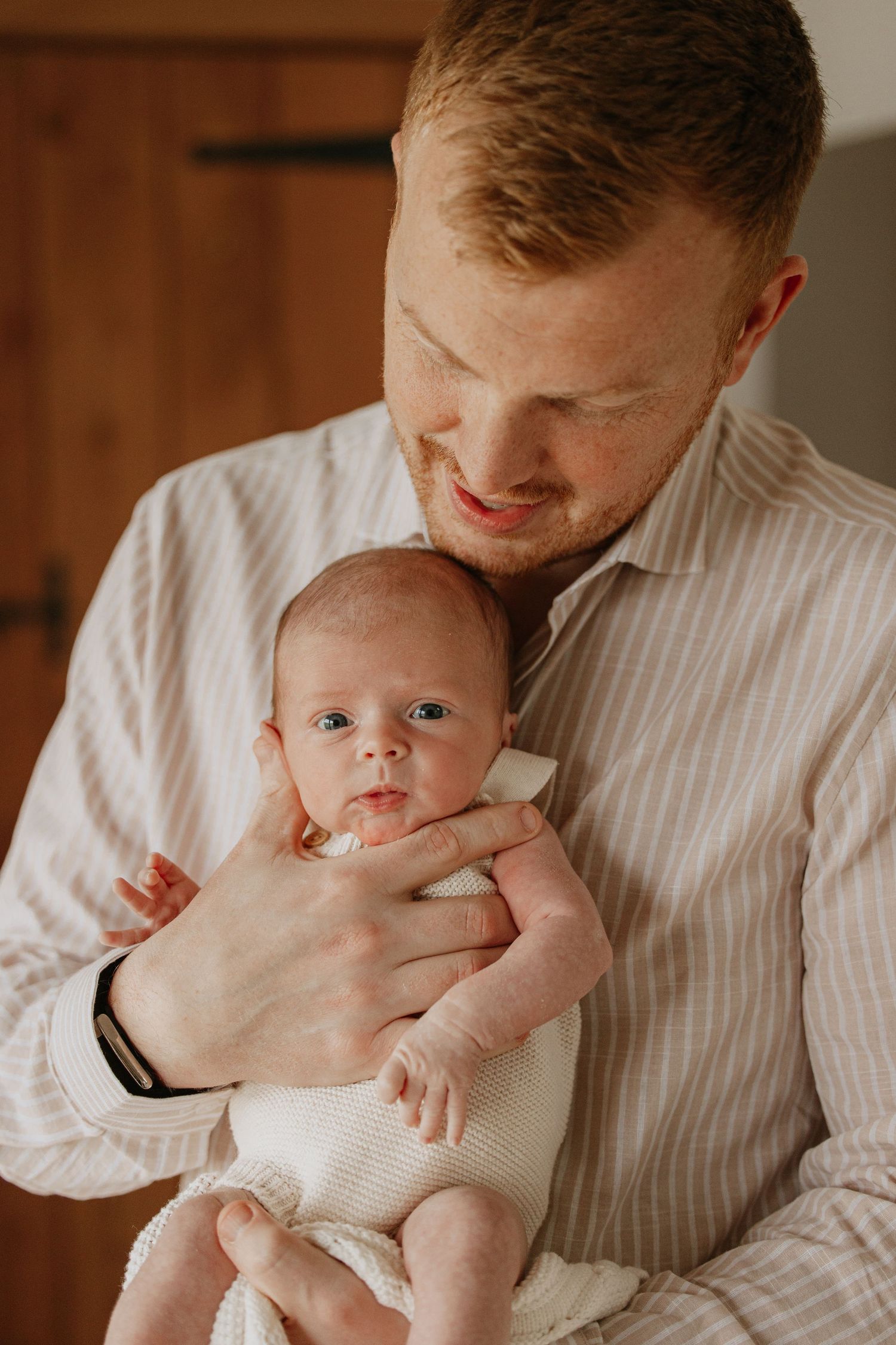 Dad and baby in newborn photos in Kent