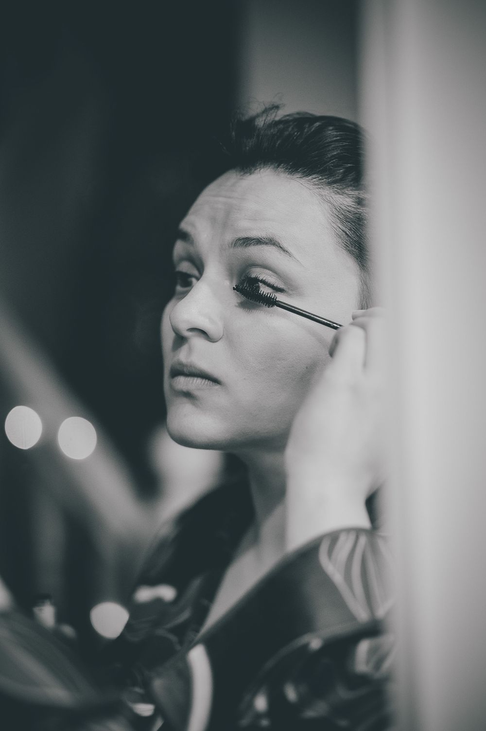 Black and white profile portrait series showing dramatic lighting and shadows on the subject looking upward.