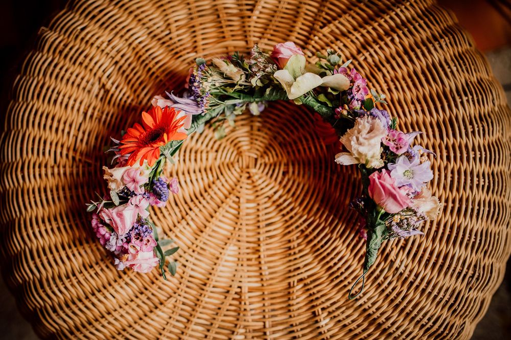 Woven wicker basket with pink and red floral arrangements displayed in a sequence of progressive decoration stages.