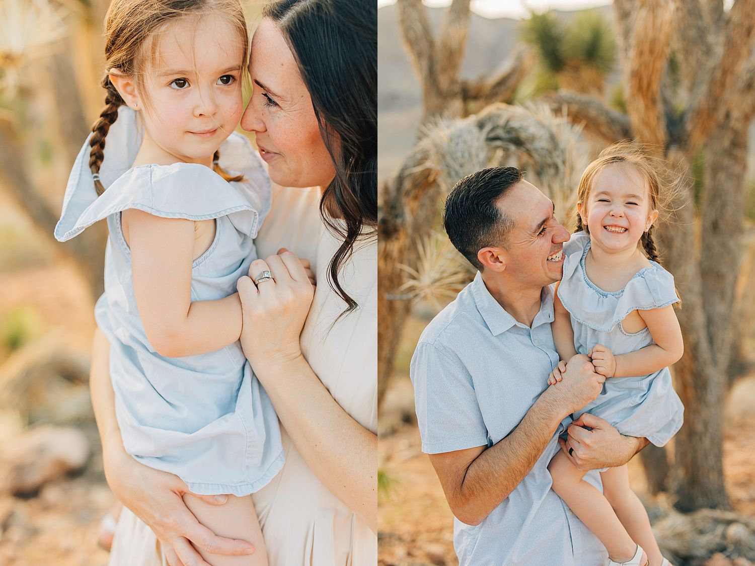 A mother and father each lovingly hold their young daughter in a sunny desert setting with Joshua trees.
