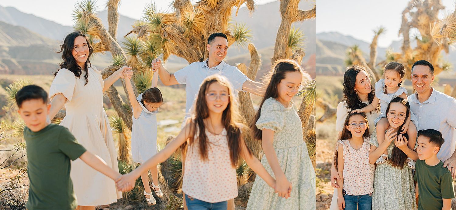 A joyful family poses outdoors near Joshua trees in a sunny desert landscape, wearing coordinated outfits in soft, neutral tones.