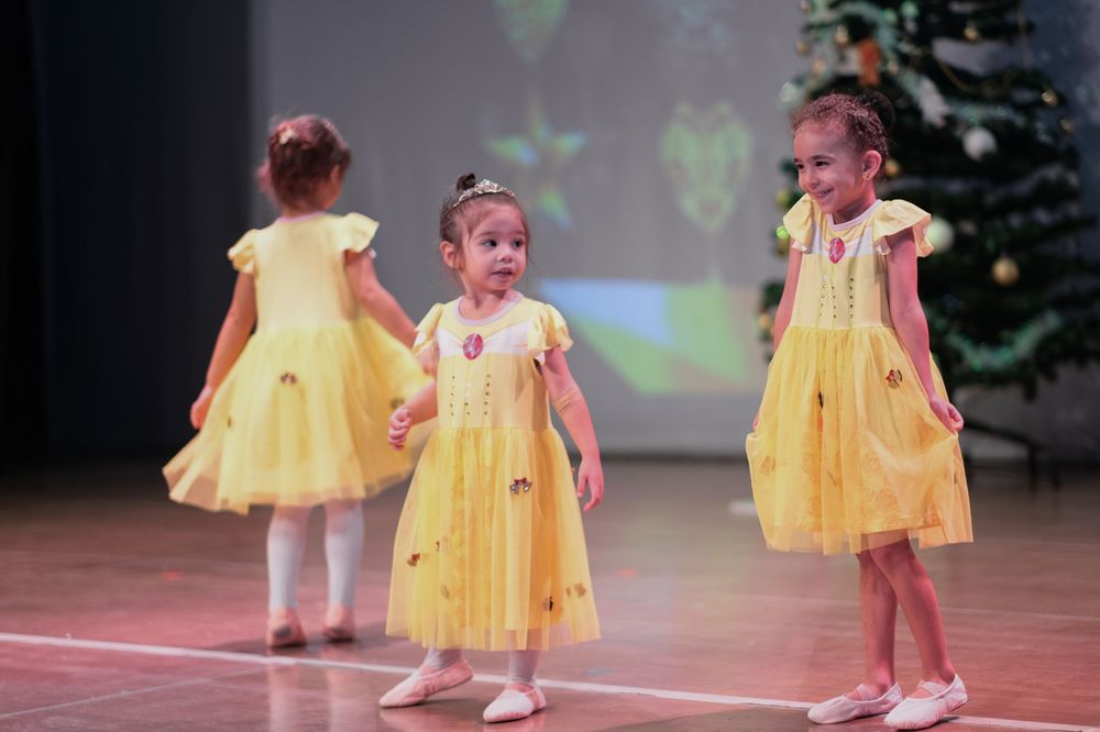 Kids stage dancing photoshoot capturing vibrant school performance in Dubai