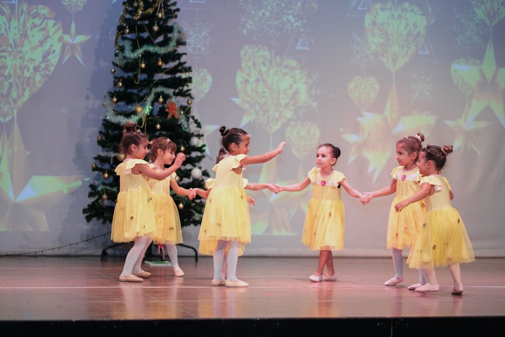 Kids stage dancing photoshoot capturing vibrant school performance in Dubai