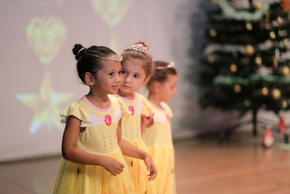 Kids stage dancing photoshoot capturing vibrant school performance in Dubai