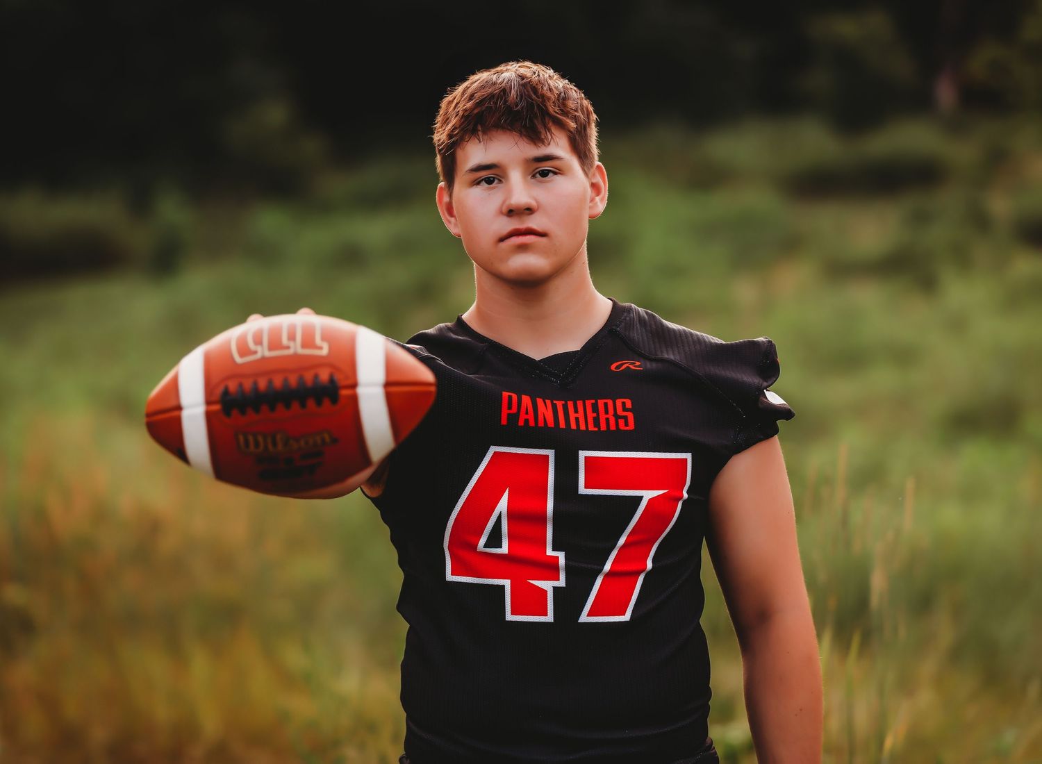 Athletic portraits featuring someone in a black football uniform with number 47.
