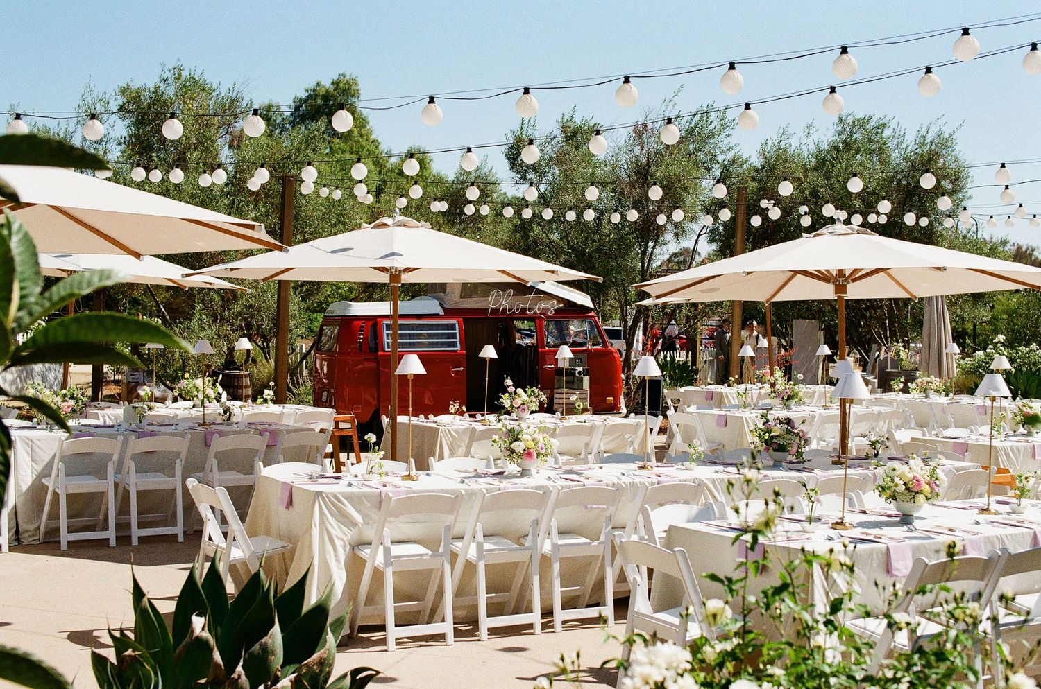 A classic VW bus photo booth captured on 35mm film at a fun and non-traditional Orange County wedding reception.
