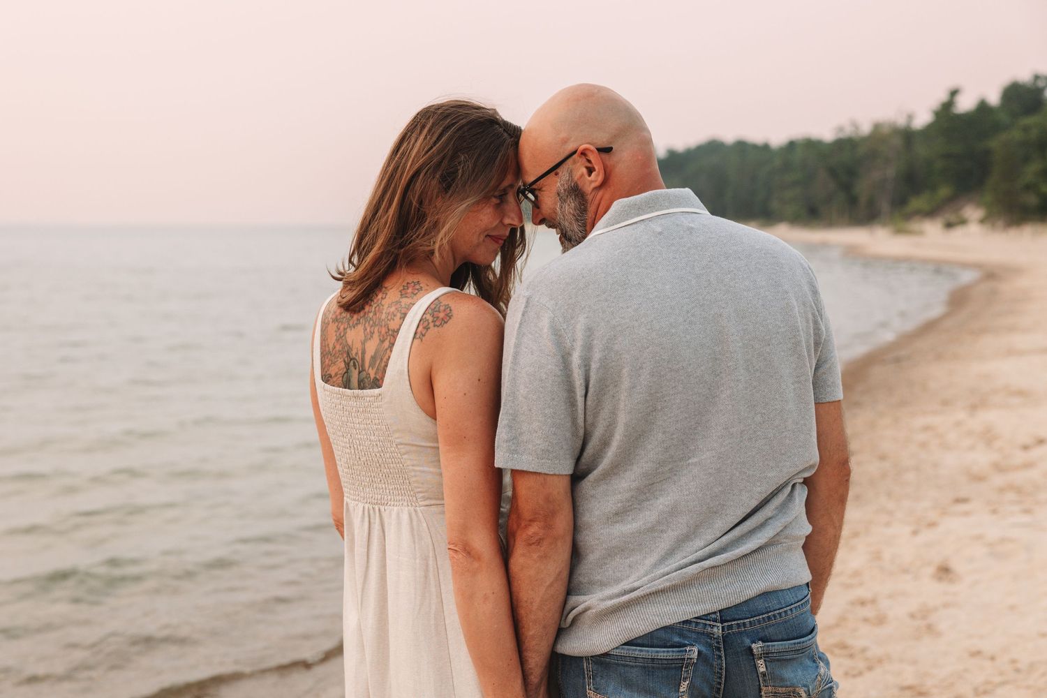 Couples photoshoot in Traverse City at beach during sunset