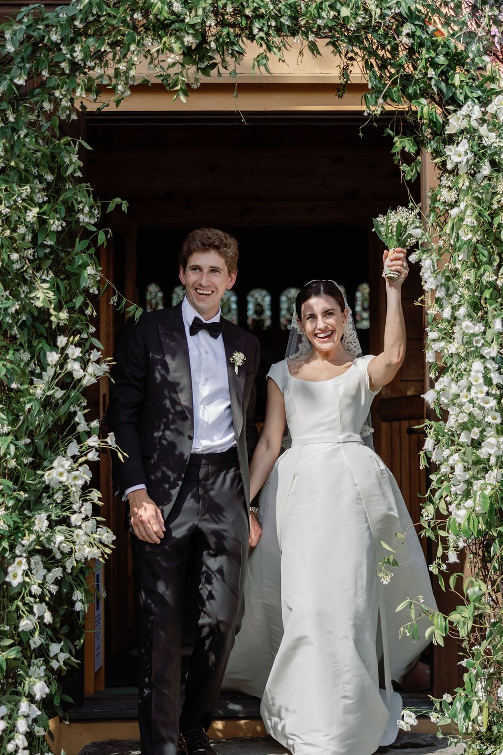A black and white wedding photo series showing a couple in a vintage car outside an elegant white building.