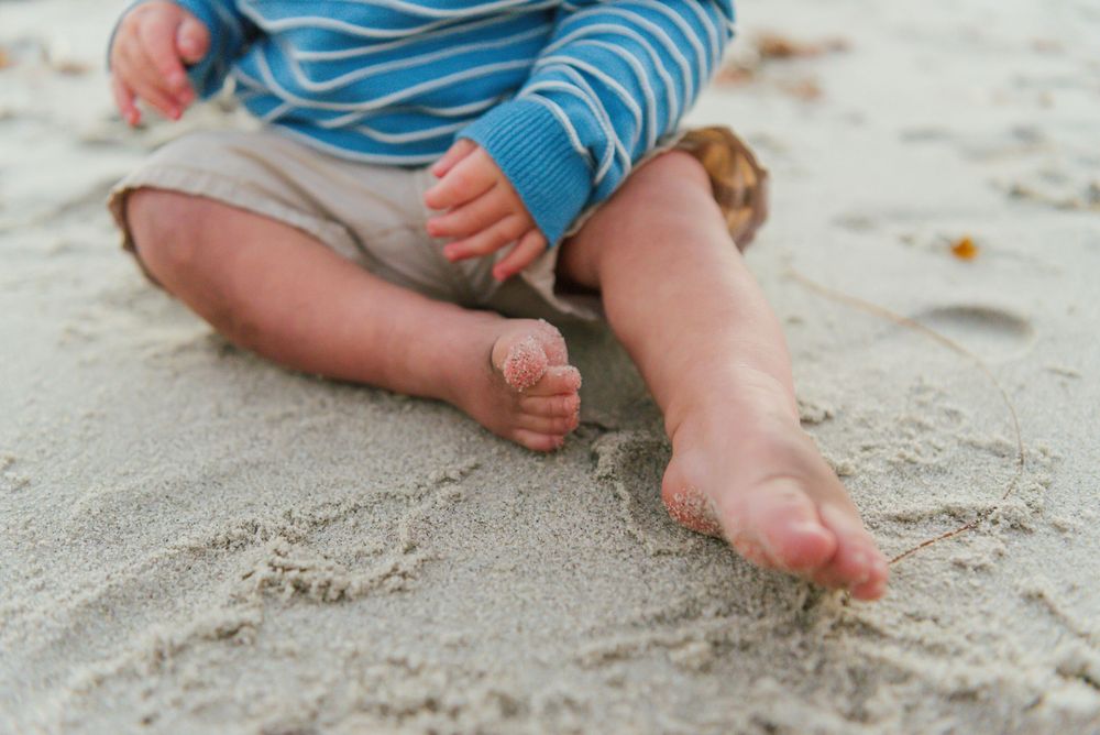 Windansea Beach family photos in San Diego with playful, candid moments by the ocean.