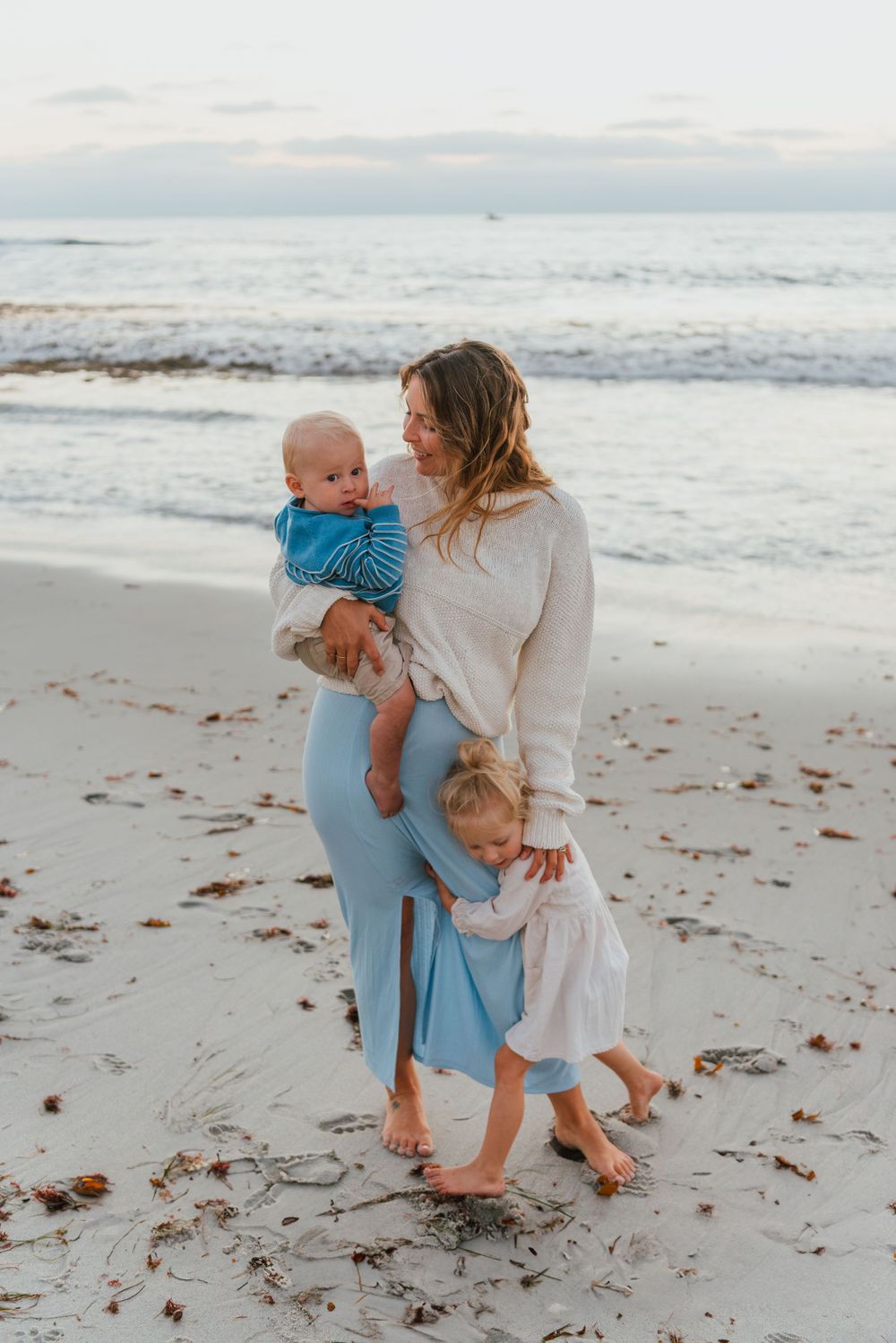 Windansea Beach family photos in San Diego with playful, candid moments by the ocean.