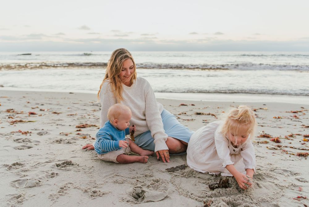 Windansea Beach family photos in San Diego with playful, candid moments by the ocean.