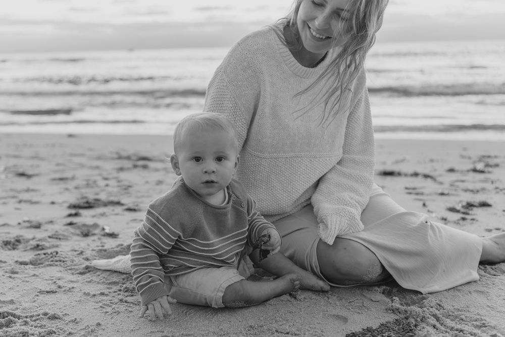 Windansea Beach family photos in San Diego with playful, candid moments by the ocean.