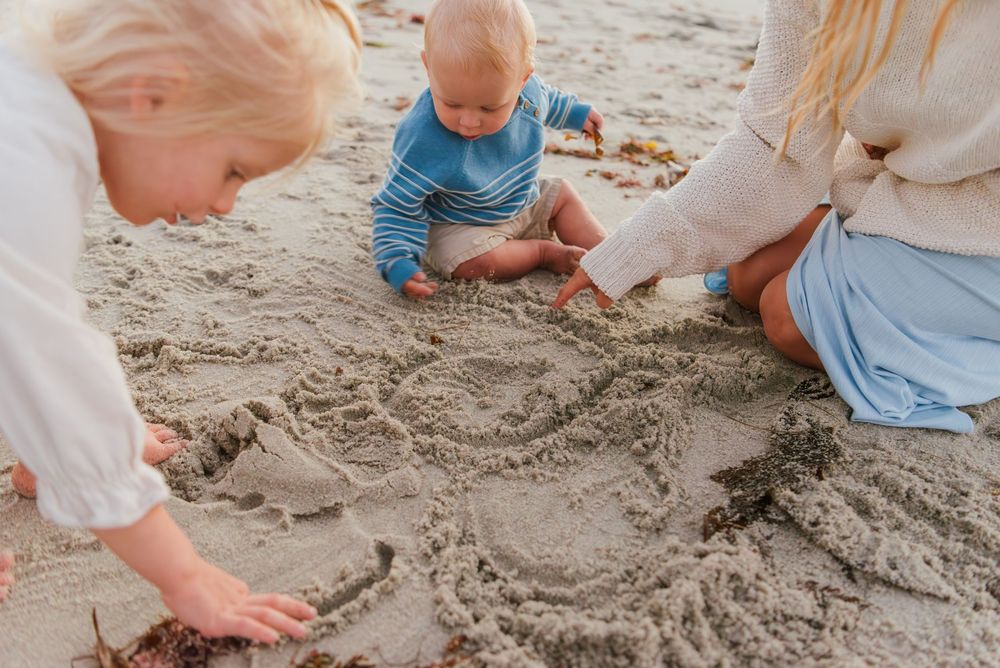 Windansea Beach family photos in San Diego with playful, candid moments by the ocean.