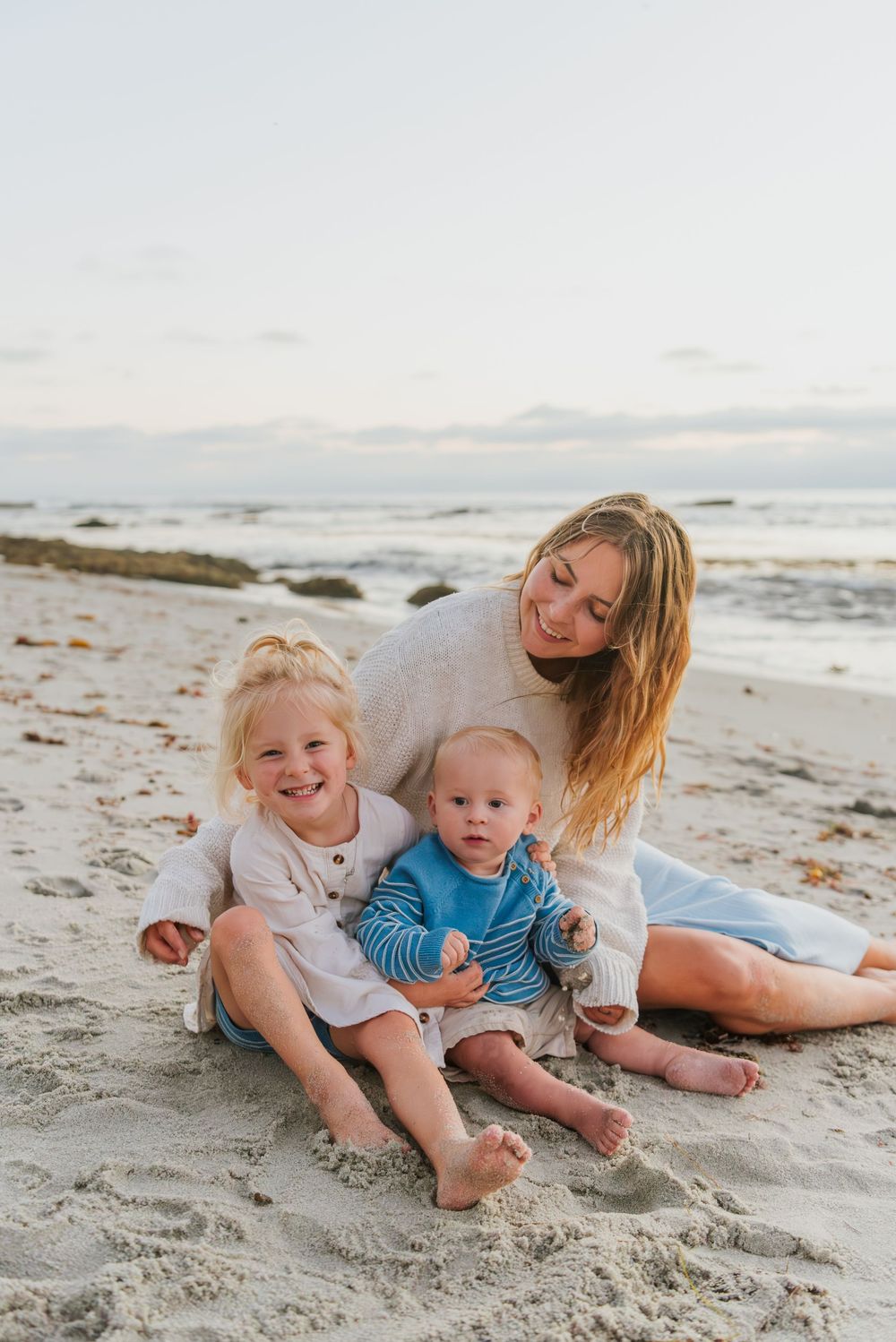 Windansea Beach family photos in San Diego with playful, candid moments by the ocean.