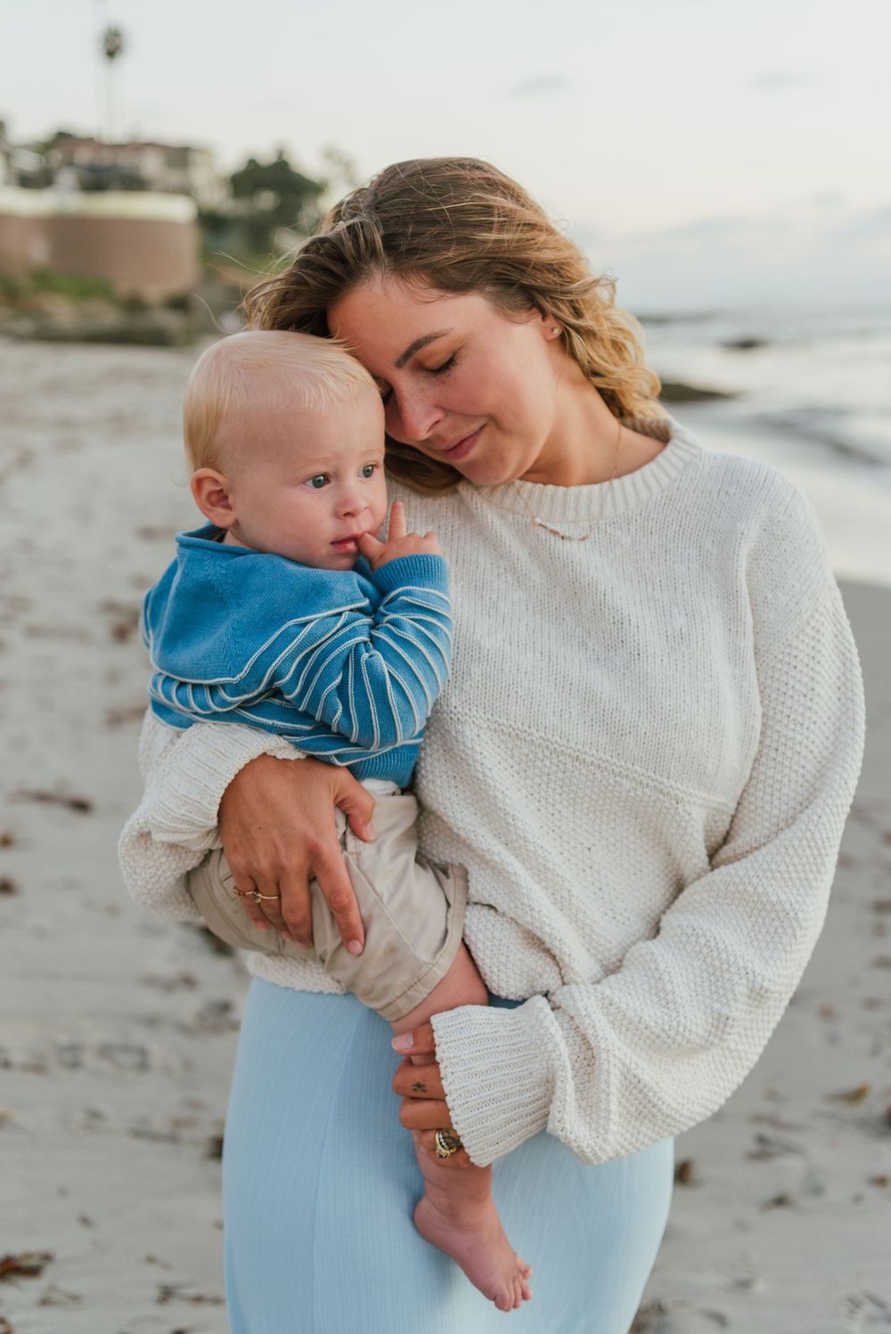 Windansea Beach family photos in San Diego with playful, candid moments by the ocean.