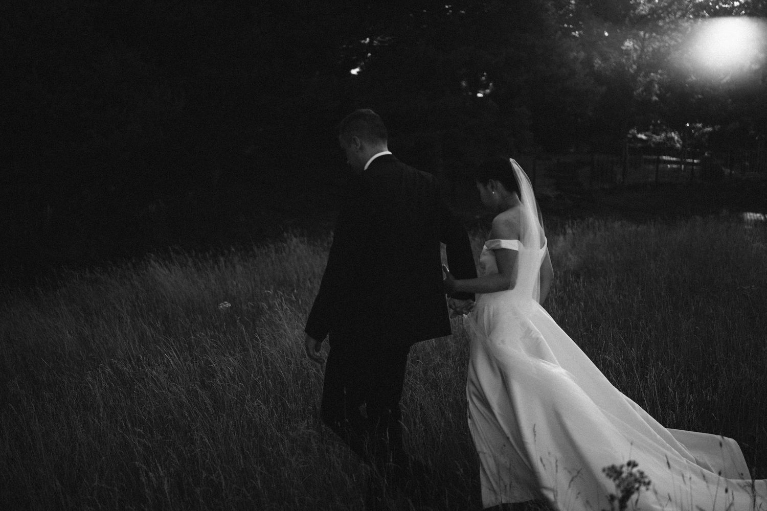 Romantic night portrait of bride and groom, atmospheric wedding photography by Will Stedman