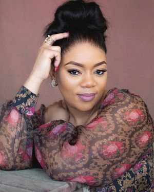 A series of fashion portraits showing a model in a sheer floral lace top with dramatic makeup and upswept hairstyle.