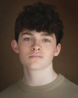 Portrait series showing different angles and lighting on a person with dark hair against a brown background.