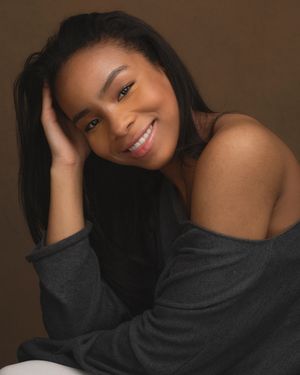 A series of headshots showing a person in a dark sweater against a brown background with varying poses and expressions.