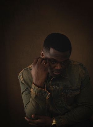A series of moody, dimly lit portraits showing a person wearing a denim jacket in dark atmospheric lighting.