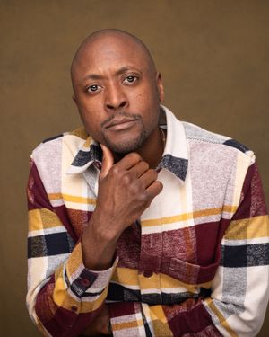 A sequence of expressive portrait shots showing someone wearing a striped burgundy and yellow sweater against a brown backdrop.