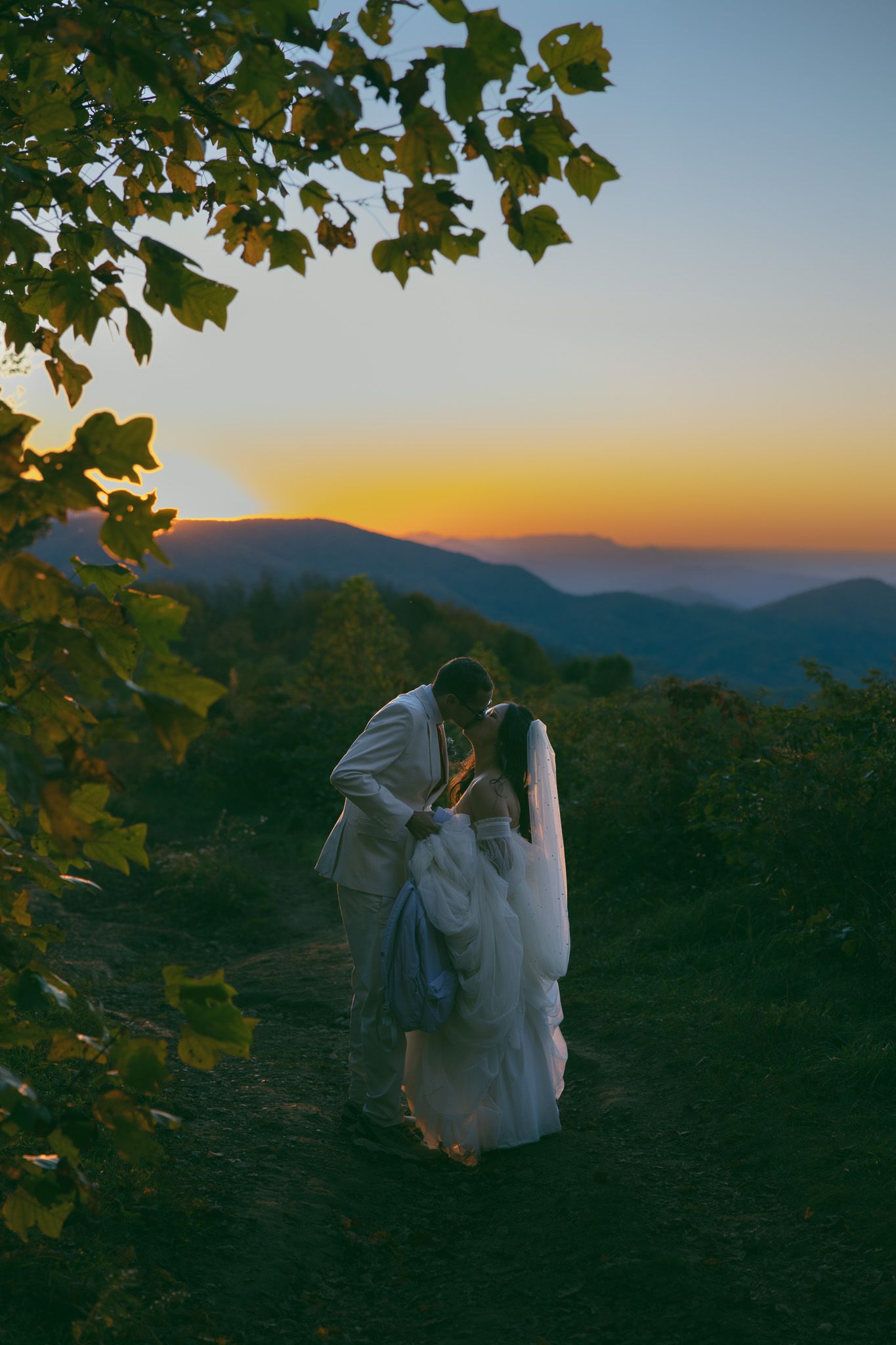 blue ridge mountains sunset elopement wedding day bride groom kissing dress asheville fall trees