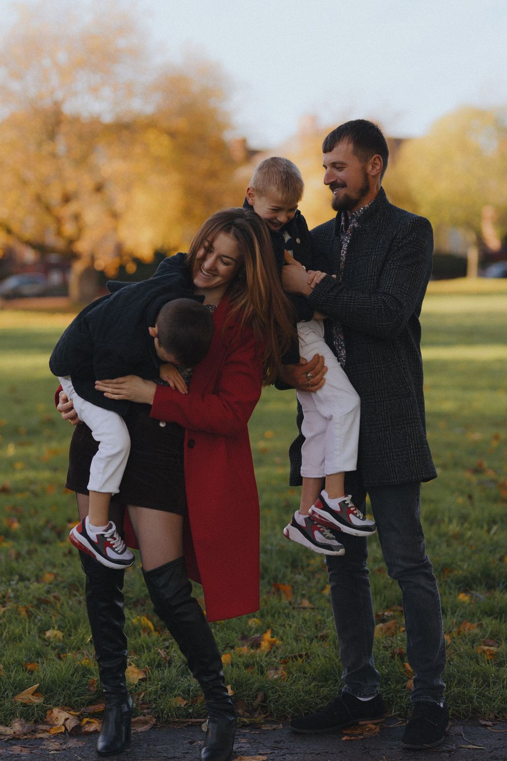 Candid family moments captured in sequence during playful autumn park outing.