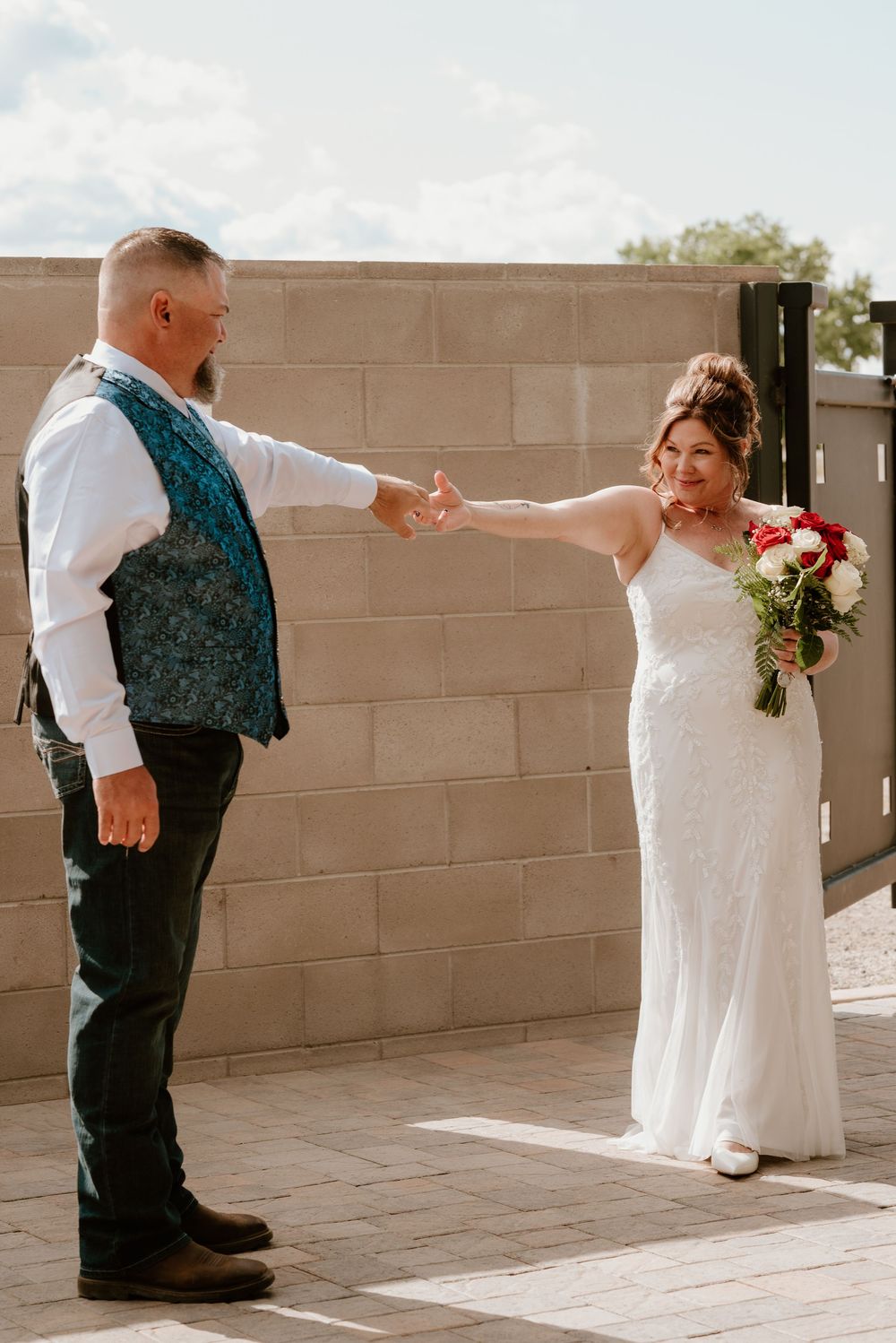 Five sequential wedding photos show couple facing the wall in different candid poses along an outdoor brick wall.