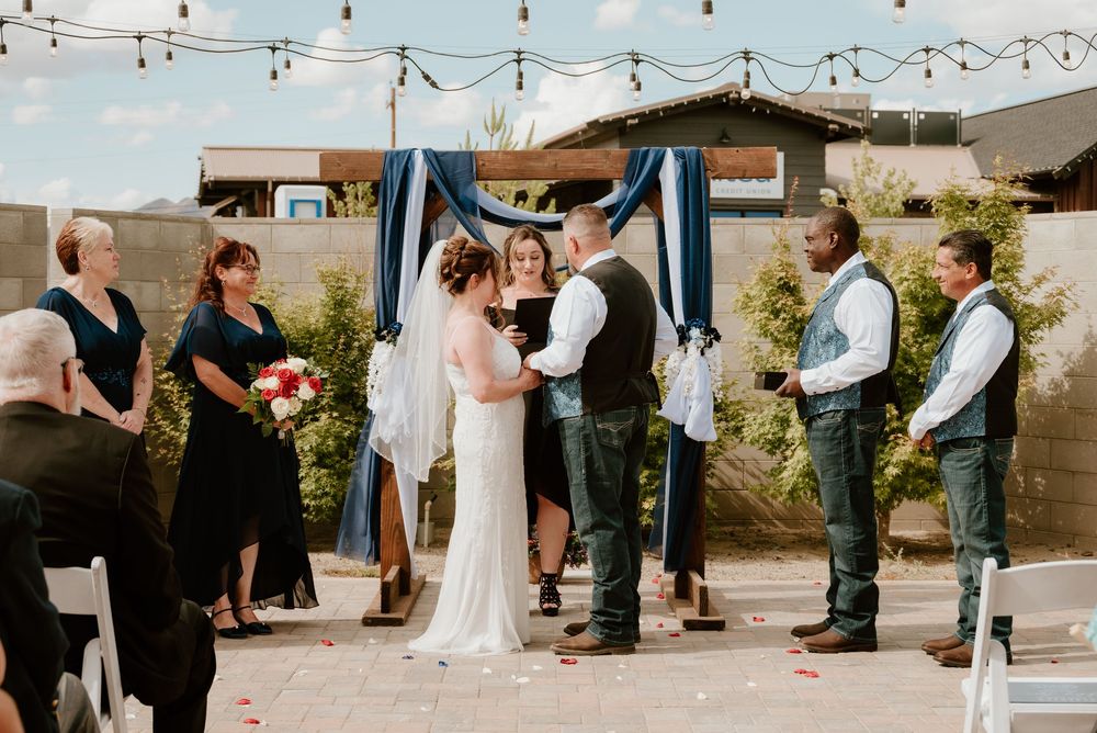 A montage of outdoor wedding moments showing a string light decorated venue and ceremony proceedings.