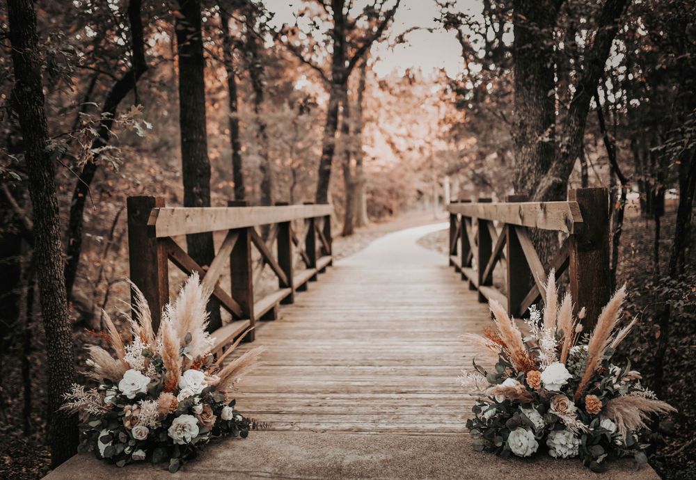 rustic bridge decorated with boho fall florals taken by april pinto photography