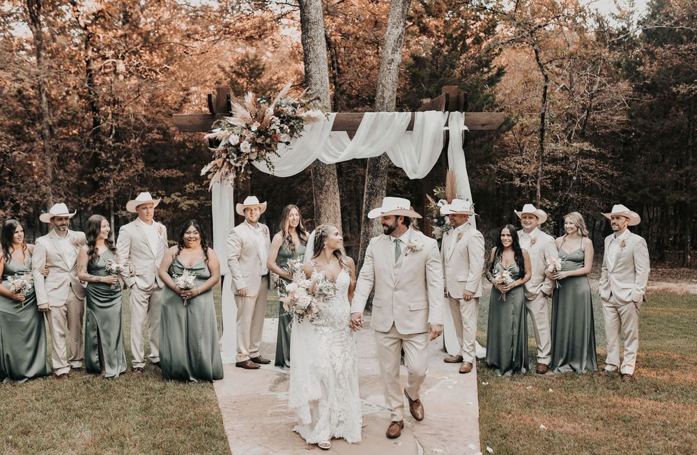 Rustic fall bridal party portraits with cowboy boots, olive green dresses, and elegant lace details