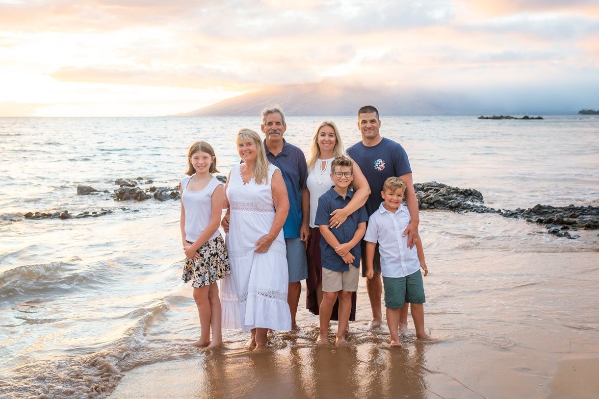 Maui family photographer photo against beautiful Maui sunset beach by ohwowfotos.