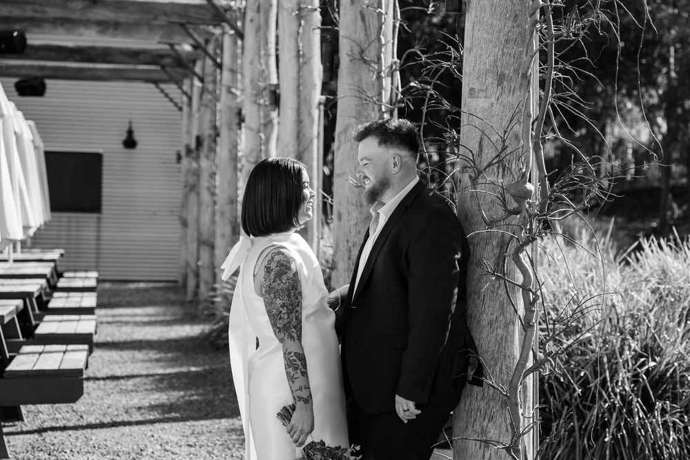 A black and white collage of outdoor wedding moments showing guests and couples in various candid settings.