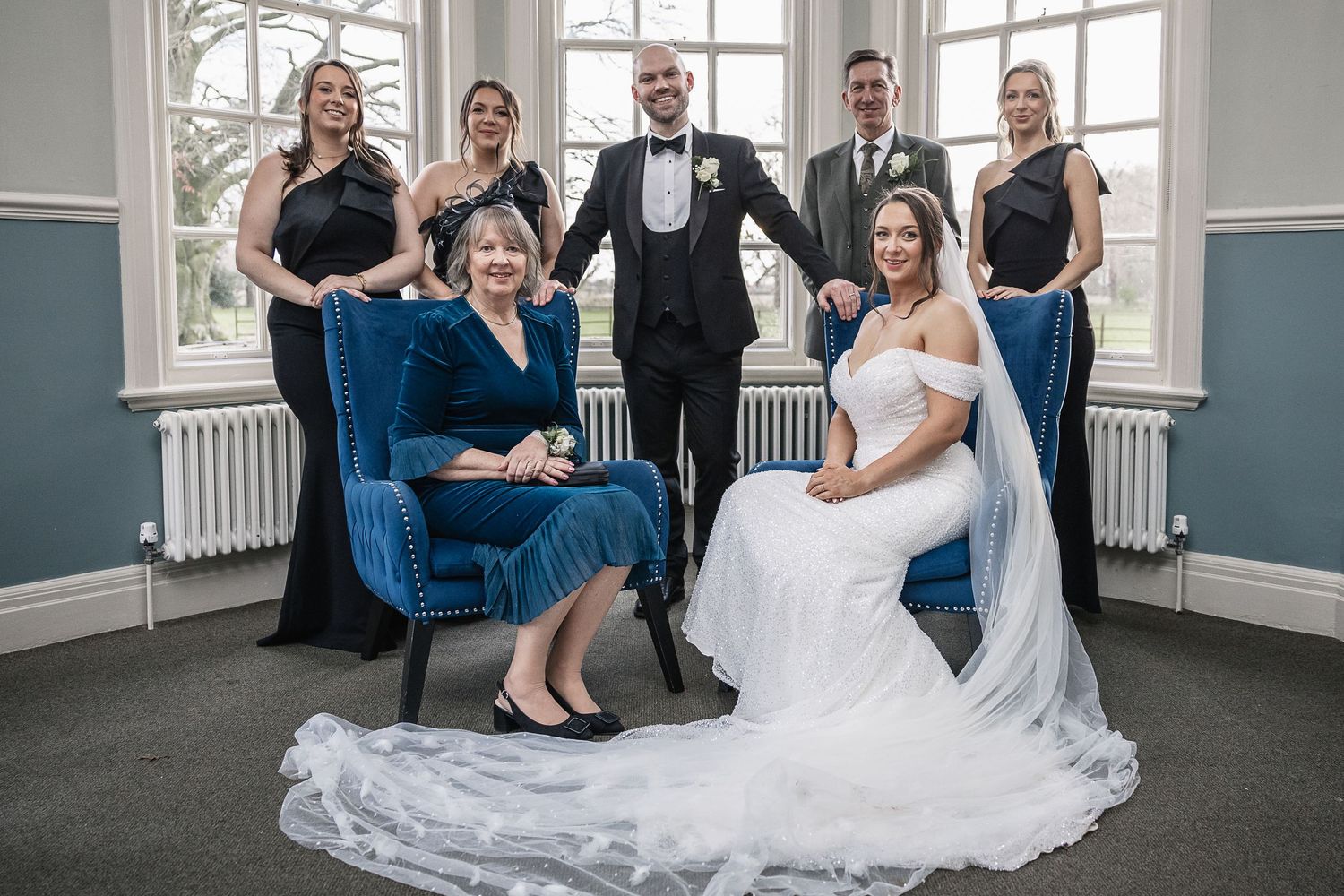 Wedding group photograph in the Kelham House Dressing Room taken during wet weather