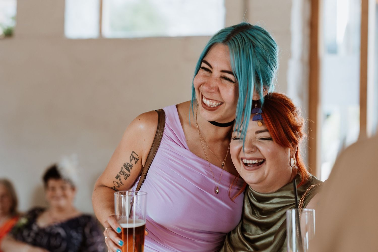 Two girls at wedding laughing and chatting at The Courtyard Venue