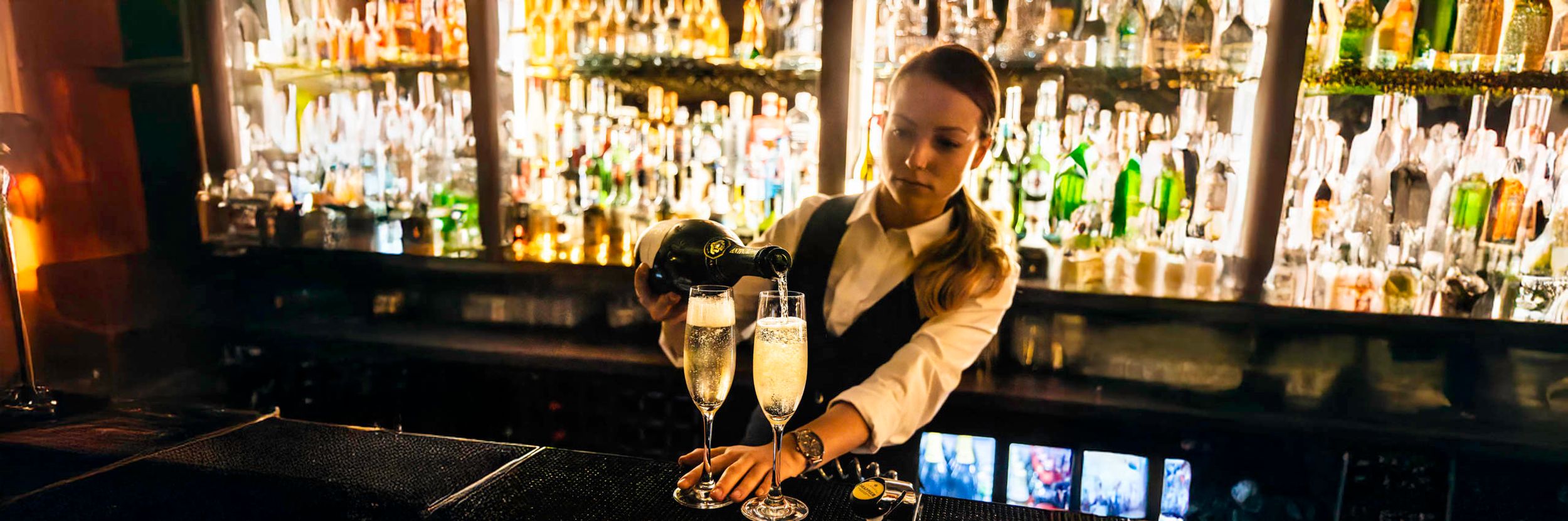Food Photographer in London | Bar staff serve champagne