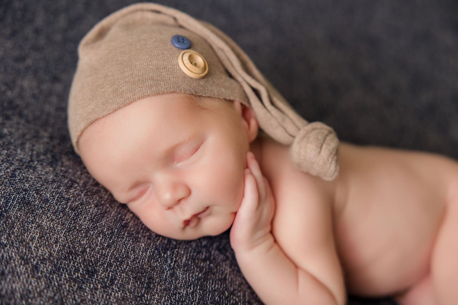 A series of peaceful newborn photographs showing a baby sleeping in different poses with soft lighting and textures.