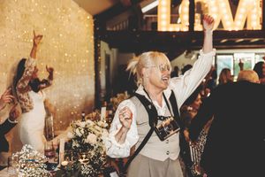 A collage of wedding celebration moments showing dancing, toasts, and joyful interactions between guests and newlyweds.
