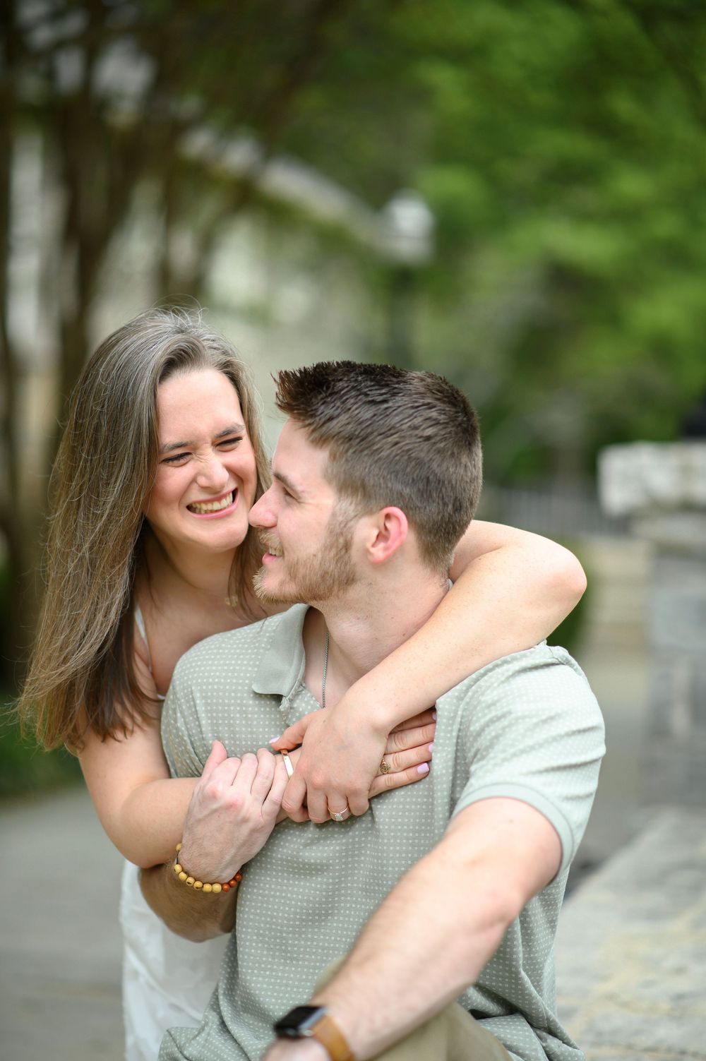 A romantic engagement photo sequence showing a couple embracing and sharing sweet moments together outdoors.