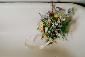 Ethereal floral arrangements with wildflowers and greenery captured in soft natural light.