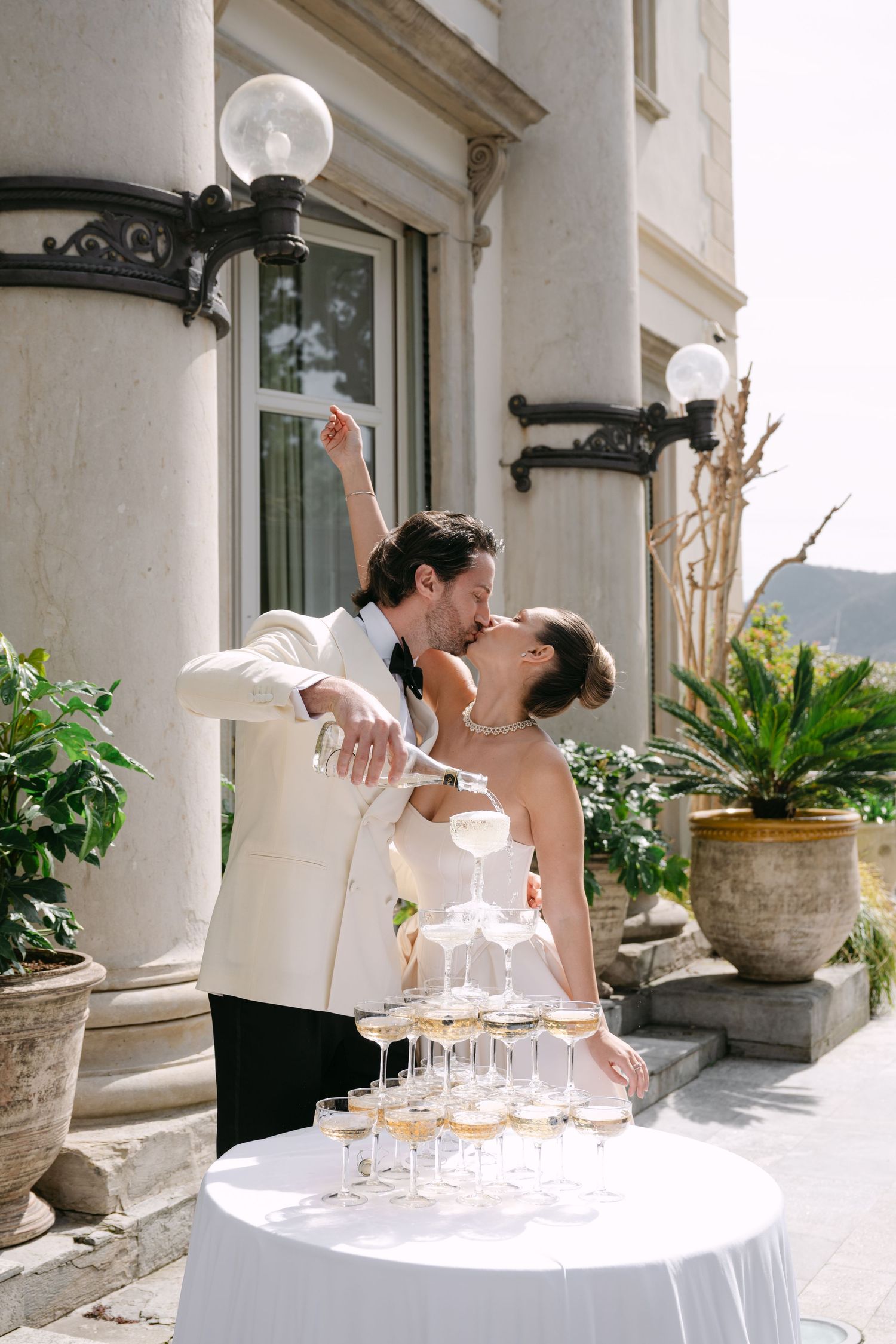 A romantic proposal moment overlooking a coastal mountain landscape with misty views of the Mediterranean Sea below.