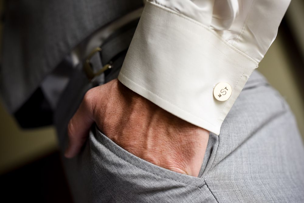 Seven cropped detail photos showing white dress shirt sleeve adjustments and cuff styling.