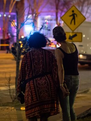 Couple looks at police lights