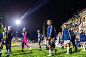 Soccer players walk out