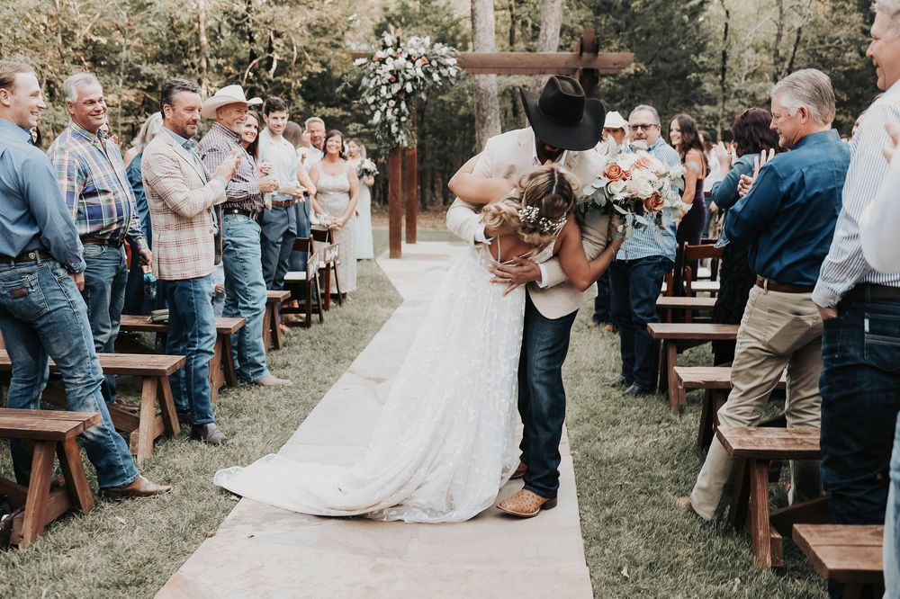 Joyful “just married” kiss at altar – April Pinto Photography
