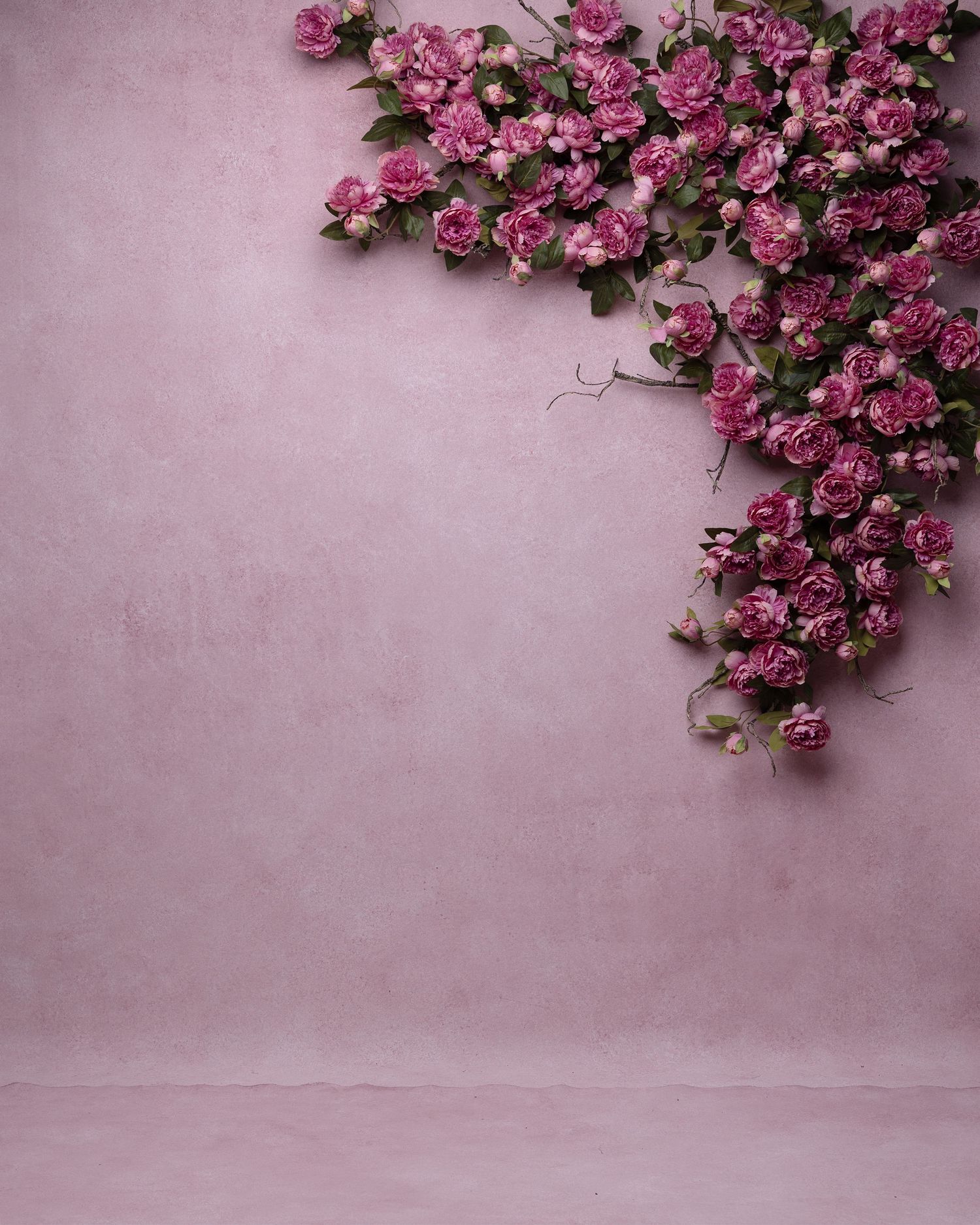White roses and flowers arranged in a corner border frame against a textured mauve purple background.