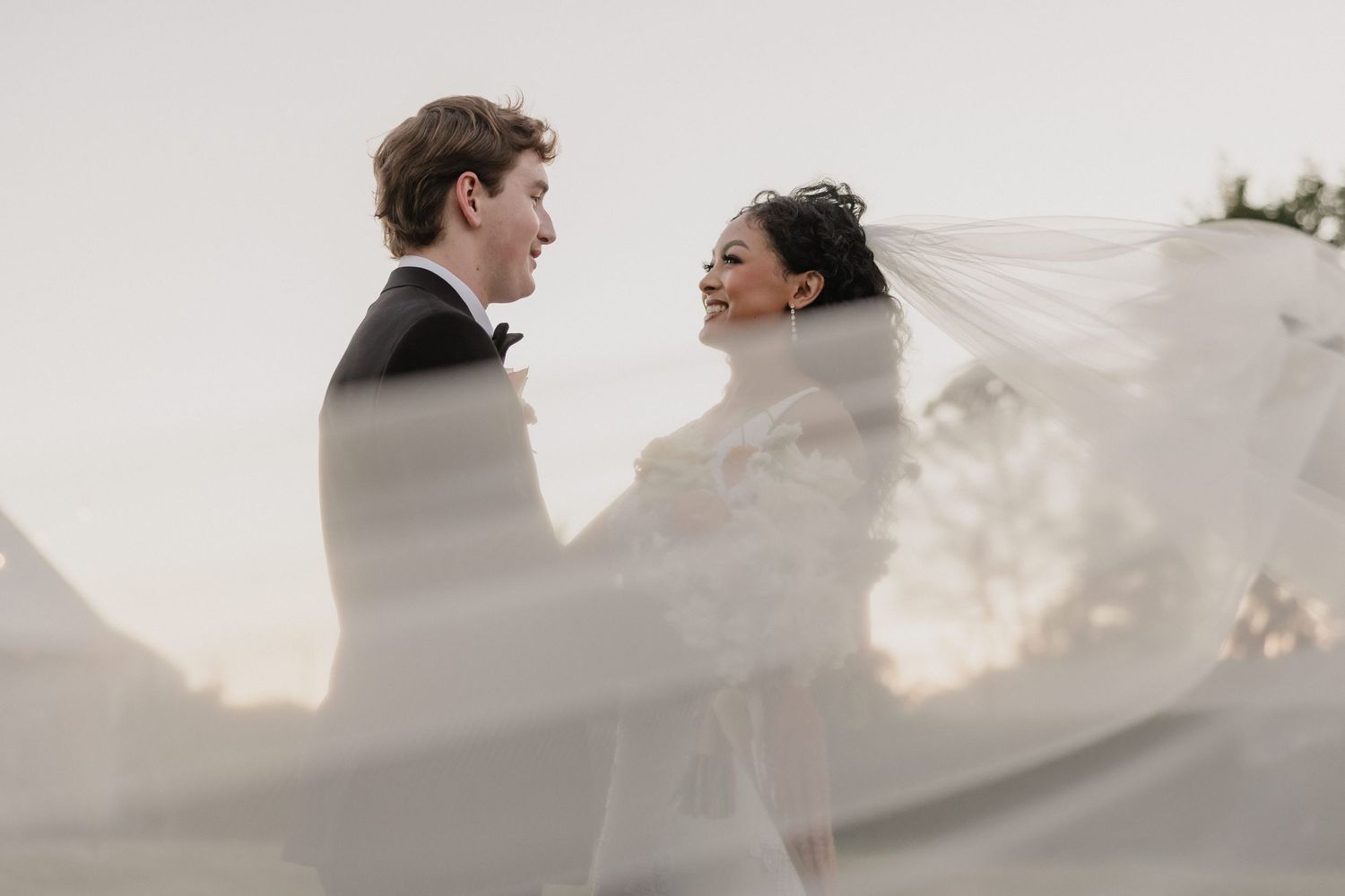 Dreamy shot showing intimate moments between a bride and groom during golden hour sunset for Sacramento wedding