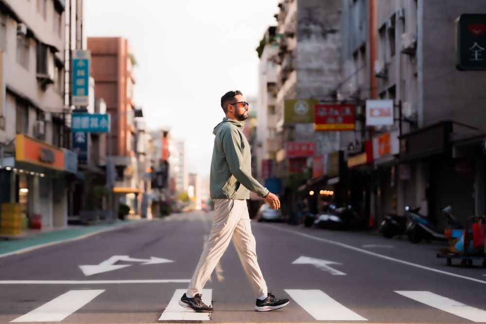 a man crossing the street in Taipei city